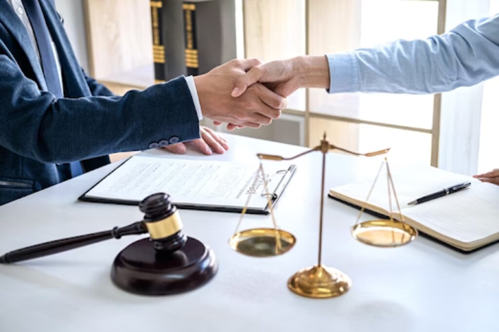 A lawyer shaking hands with the client 
